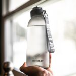 바쁜 직장인을 위한 건강관리, 일상에서 실천하는 작은 변화가 만든다 person holding gray and black tumbler