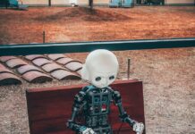 “AI와 함께하는 스마트 건강 관리…일상 속 실천법 제안” black and white robot toy on red wooden table