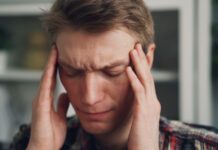 “지친 하루의 반복, 만성피로를 벗어나기 위한 작은 변화들” a man holding his hands to his ears